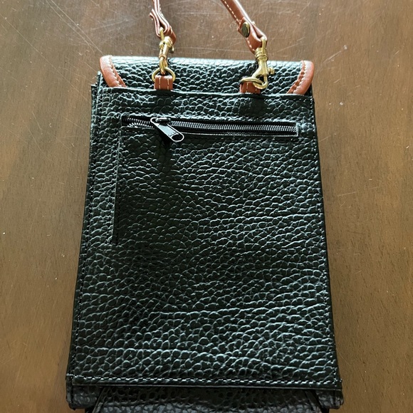 Dooney & Bourke Black and Brown Crossbody Bag.
I am not sure if a true Dooney. - Picture 5 of 5